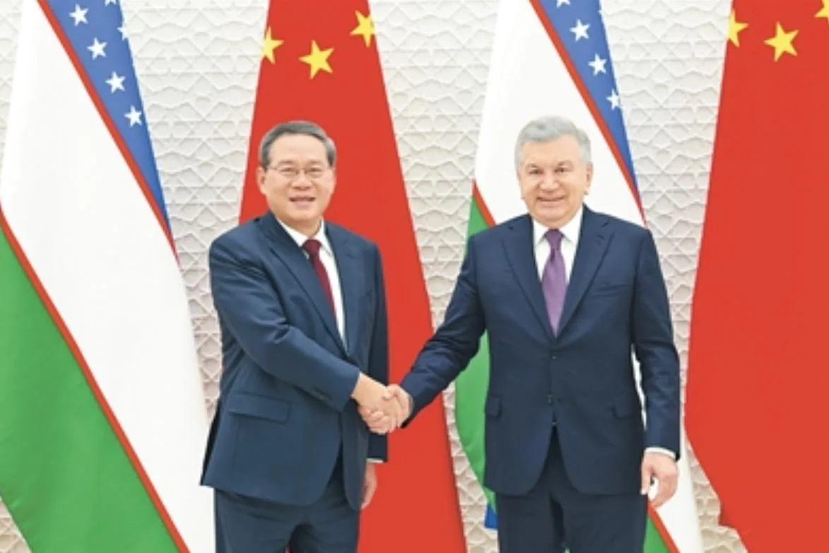 李强与乌兹别克斯坦总统米尔济约耶夫会见